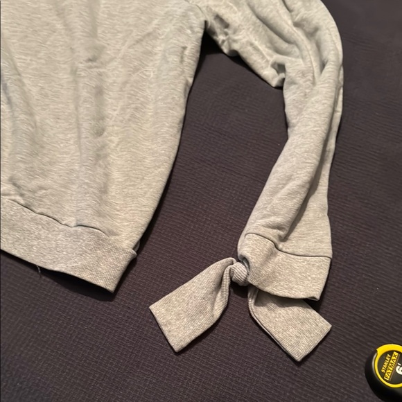 Like new Women's Off-Shoulder Light Gray Sweatshirt with ties at cuffs - Picture 5 of 8